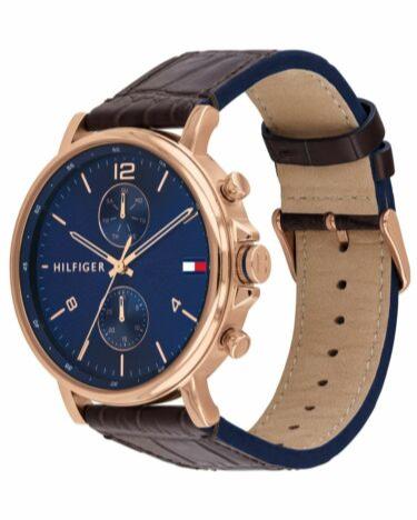 Side view of Tommy Hilfiger Daniel watch displaying brown leather strap and blue leather interior