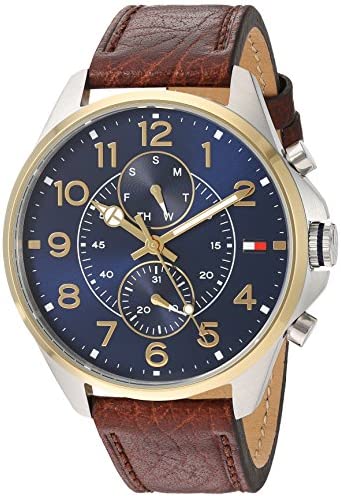 Tommy Hilfiger Dean watch at angle showing blue dial, gold accents, and brown leather strap