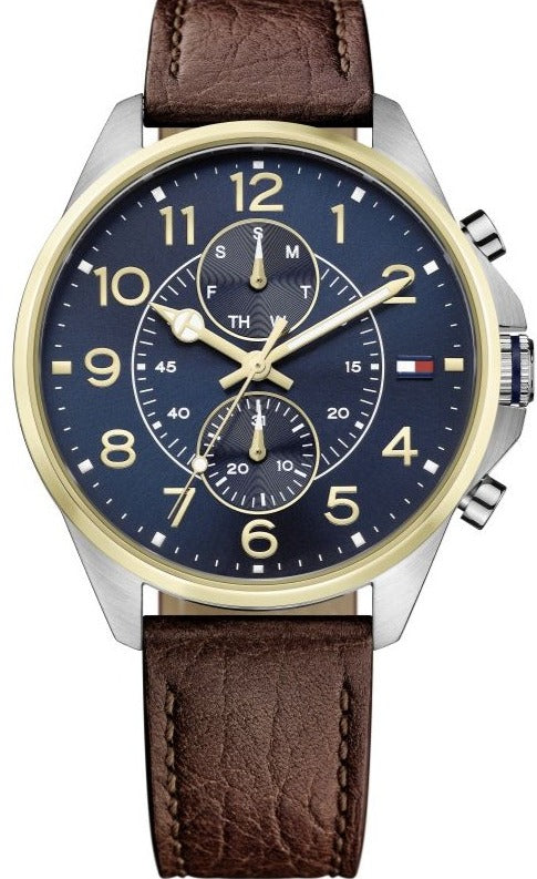 Tommy Hilfiger Dean men's watch with blue dial, gold bezel, brown leather strap, and chronograph subdials