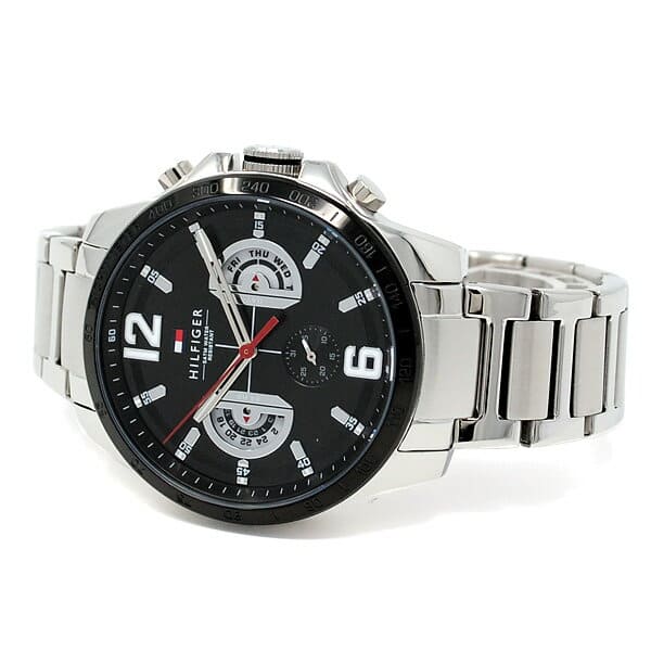 Tommy Hilfiger Decker men's watch worn on wrist showing black dial and silver bracelet