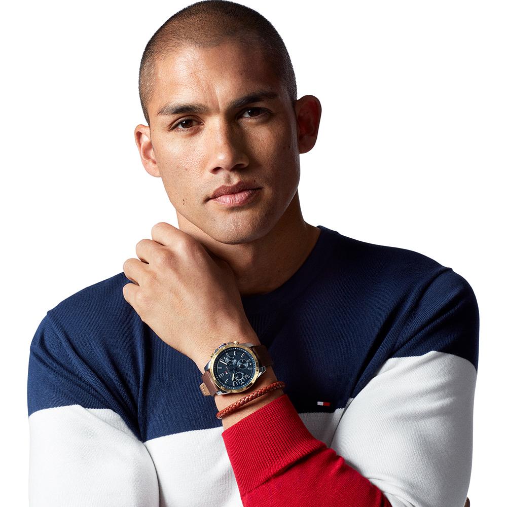 Man wearing Tommy Hilfiger Decker watch with blue dial and brown leather strap