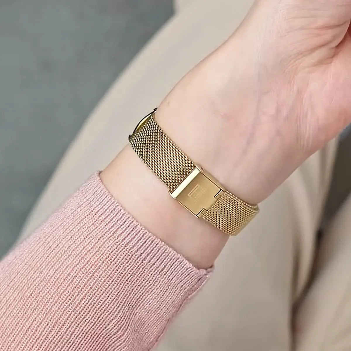 Tommy Hilfiger Demi watch on wrist displaying gold mesh bracelet and bezel closure