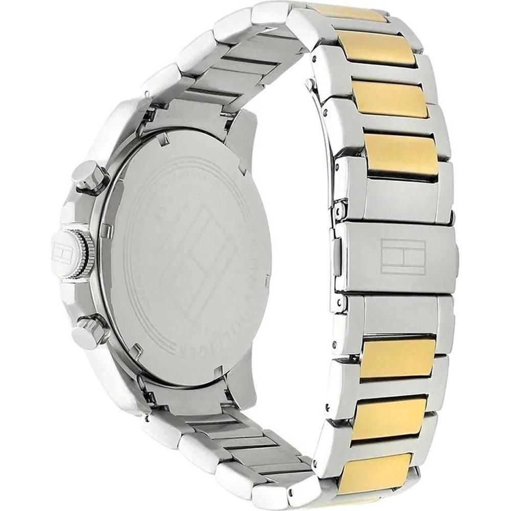 Tommy Hilfiger watch caseback and strap detail showing dual-tone steel and gold design
