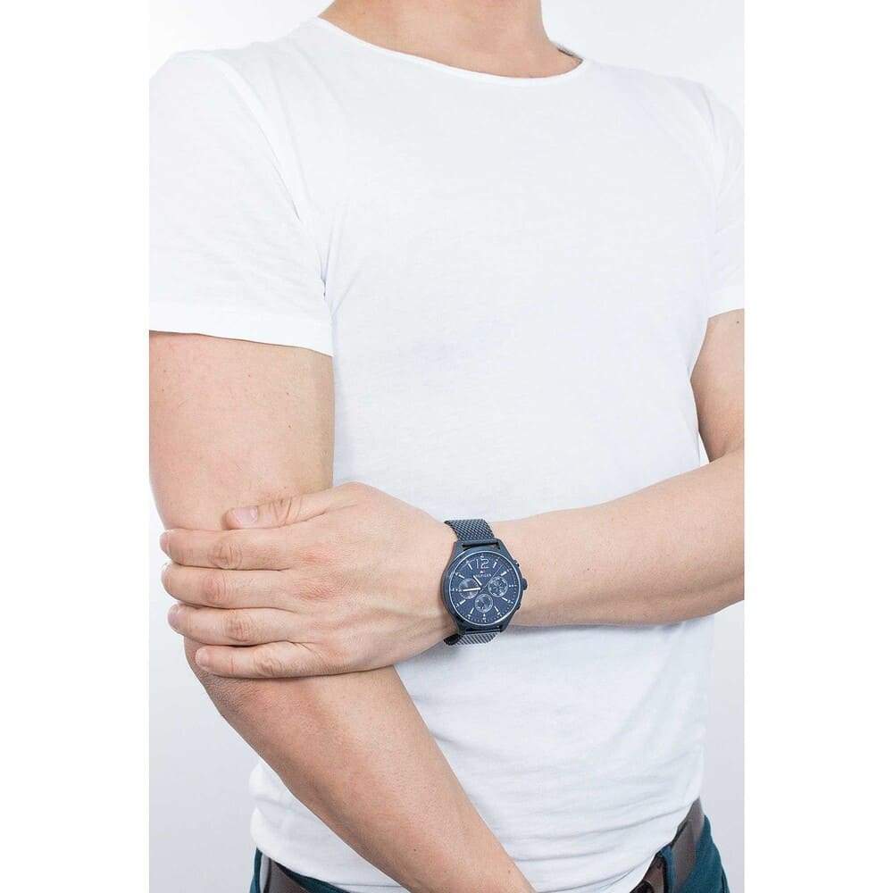 Tommy Hilfiger Gavin chronograph watch worn on wrist with blue mesh strap