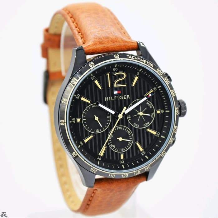 Tommy Hilfiger Gavin watch angled view showing tan leather strap and black dial
