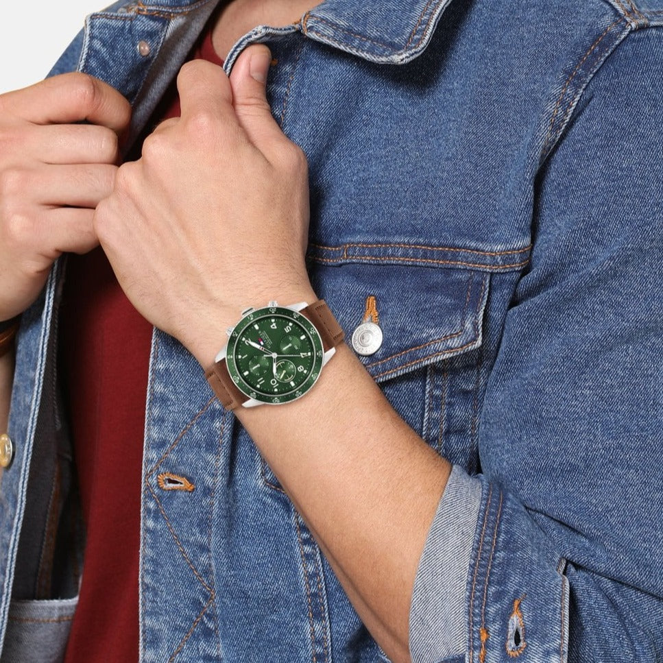 Tommy Hilfiger Jimmy chronograph watch worn on wrist with green dial visible