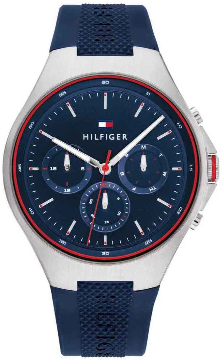Tommy Hilfiger Justin men's watch with navy dial, white case, red bezel, and navy strap