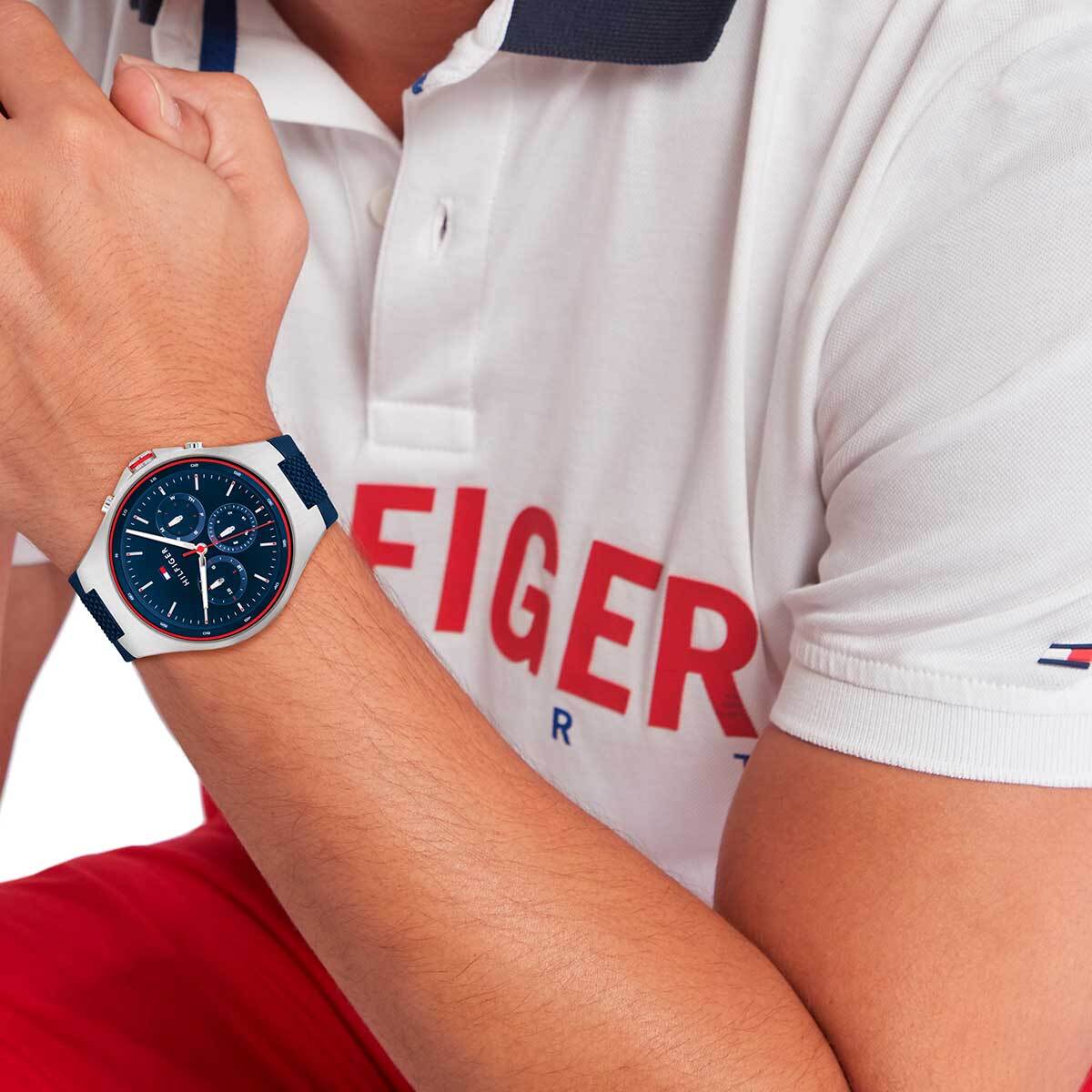Tommy Hilfiger Justin men's watch worn on wrist with navy strap and chronograph dial