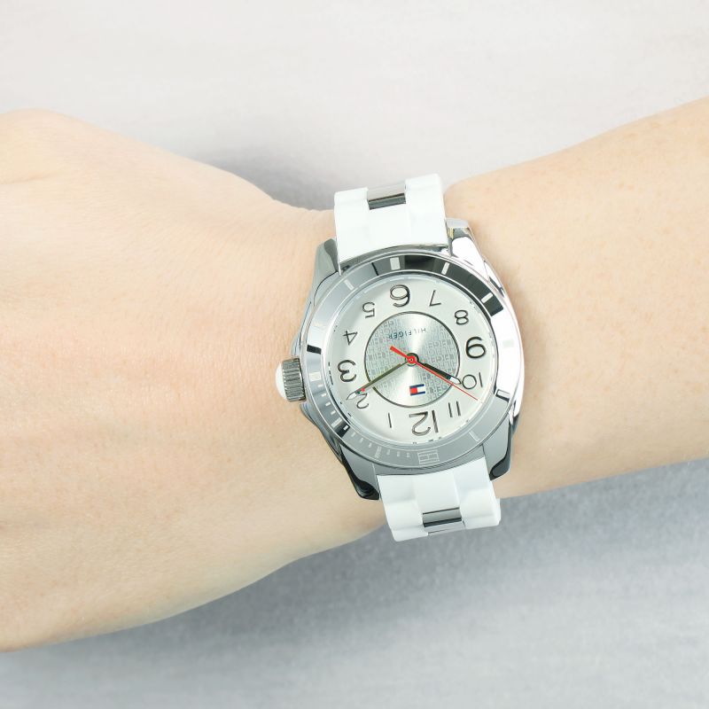 Tommy Hilfiger K2 women's watch on wrist, white strap with silver dial