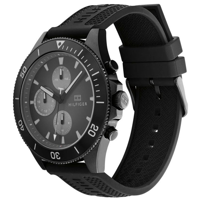 Tommy Hilfiger Larson watch shown at angle with black rubber strap visible