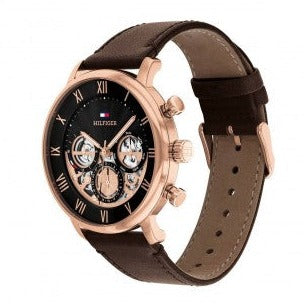 Tommy Hilfiger LEGEND watch side angle showing rose gold chronograph case and brown leather strap