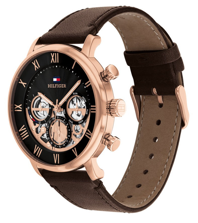 Tommy Hilfiger LEGEND watch side profile with brown leather strap and rose gold chronograph pushers