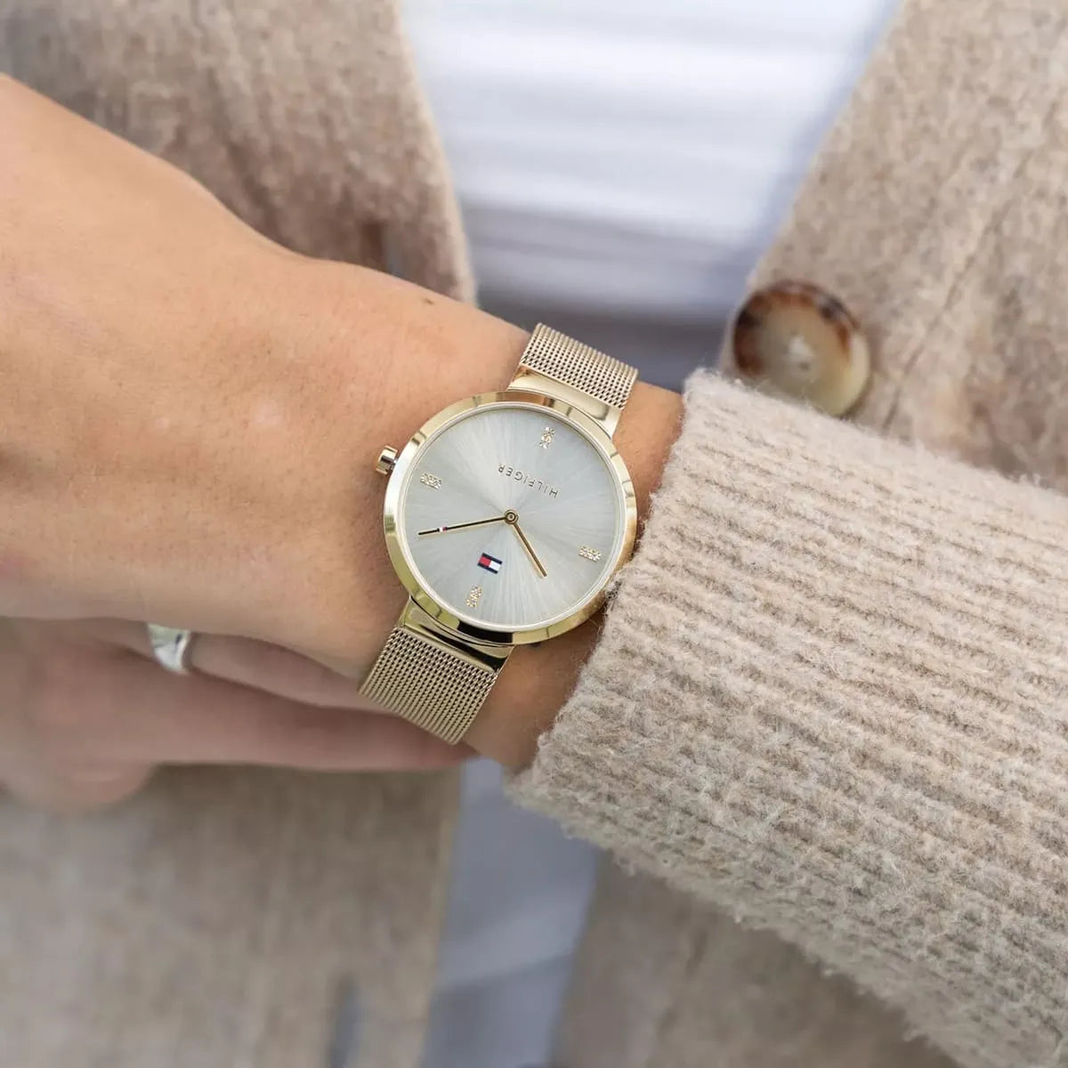 Tommy Hilfiger Liberty watch on wrist showing champagne dial and gold tone case