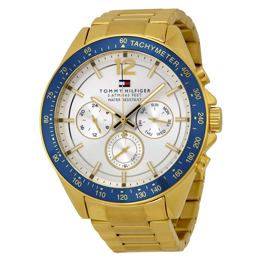 Tommy Hilfiger Luke multifunction watch with white dial, gold-tone case, and blue tachymeter bezel