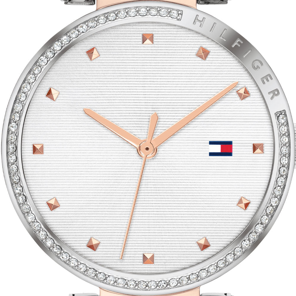 Tommy Hilfiger Lynn watch dial close-up showing rose gold accents and Tommy flag logo