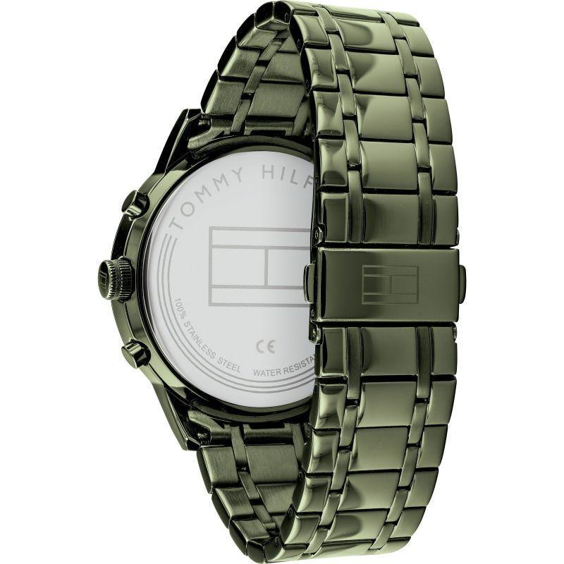 Tommy Hilfiger watch case back showing engraved logo and water resistance marking on olive green case