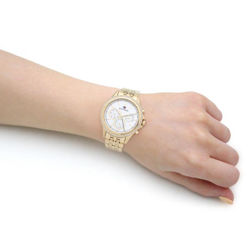 Tommy Hilfiger gold-tone women's chronograph watch worn on wrist