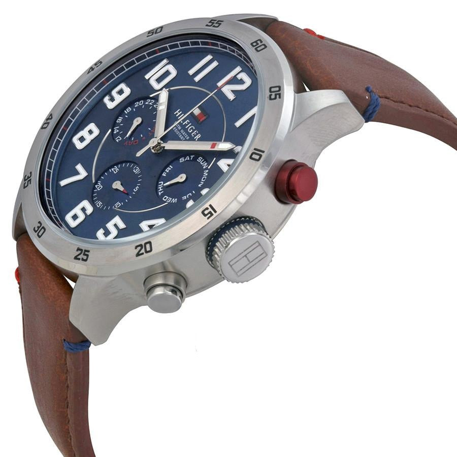 Side angle view of Tommy Hilfiger watch with visible chronograph pushers and brown leather strap