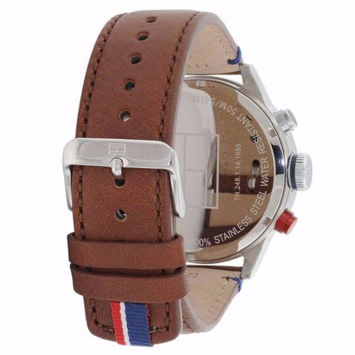 Case back view of Tommy Hilfiger watch showing stainless steel with text and brown leather strap