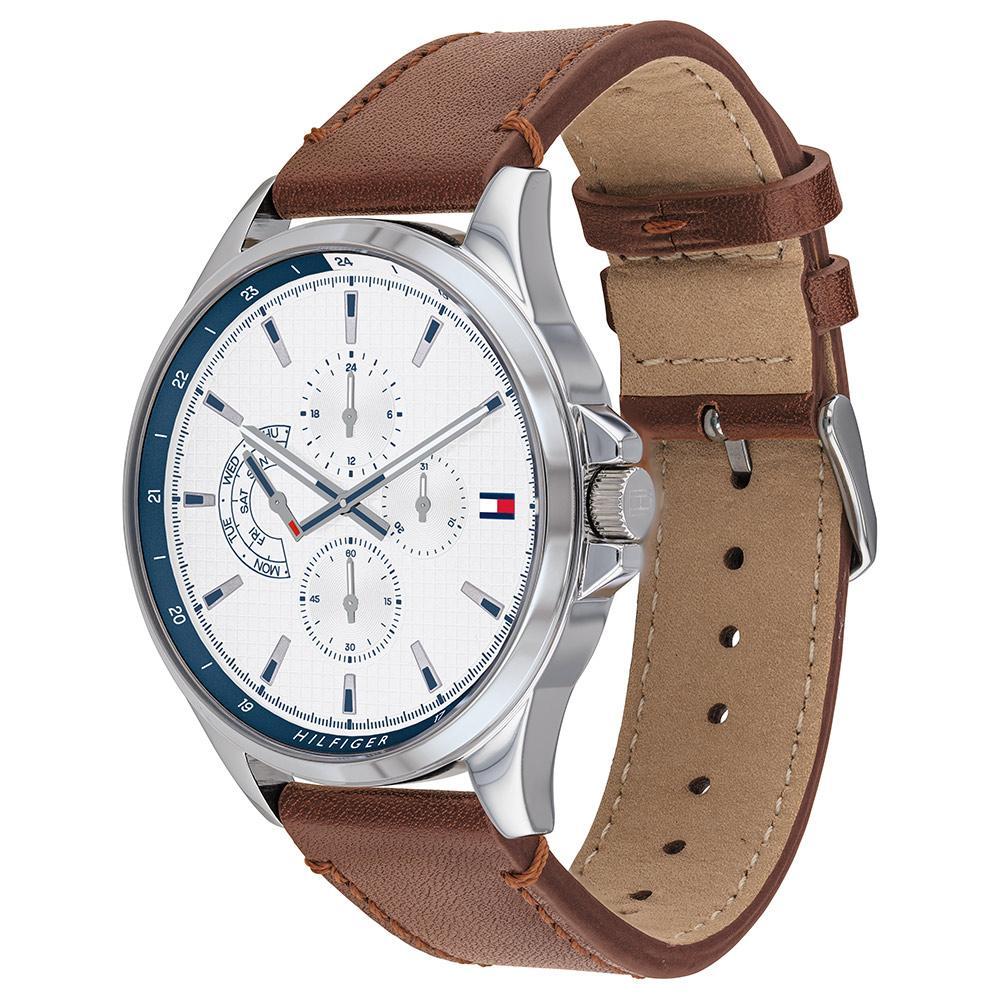 Side view of Tommy Hilfiger watch with brown leather strap and silver case