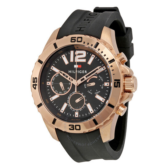 Side angle view of Tommy Hilfiger Nolan watch showing rose gold case and black silicone strap