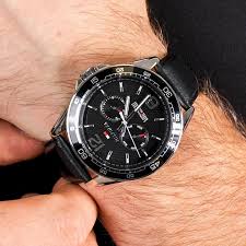 Tommy Hilfiger Sophisticated Sport chronograph watch worn on wrist showing black dial and leather strap