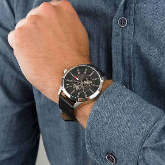 Tommy Hilfiger Spencer skeleton watch worn on wrist with black leather strap