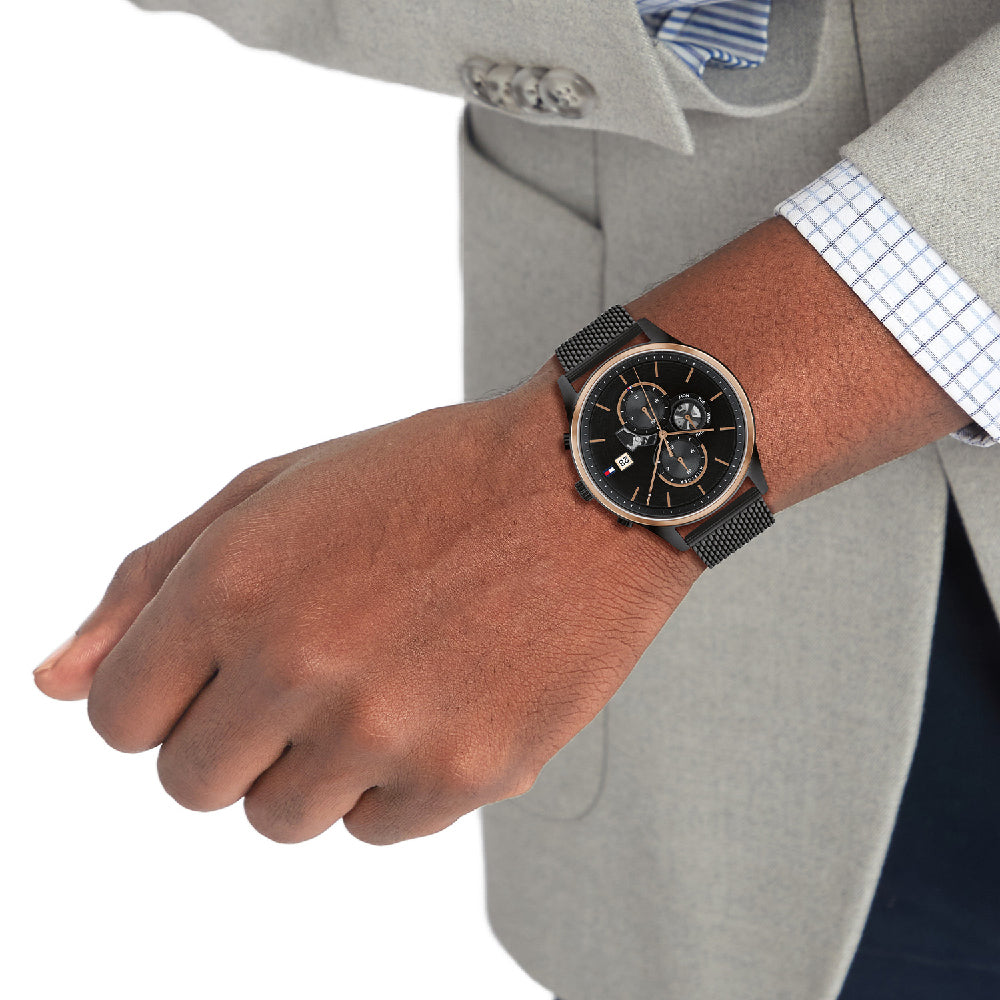Tommy Hilfiger Weston 1710505 chronograph watch worn on wrist with light business attire