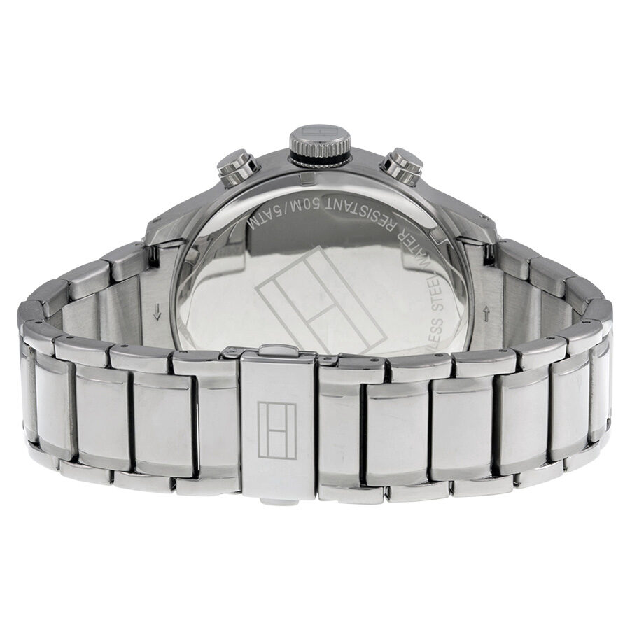 Tommy watch caseback showing stainless steel three-link bracelet and exhibition case back