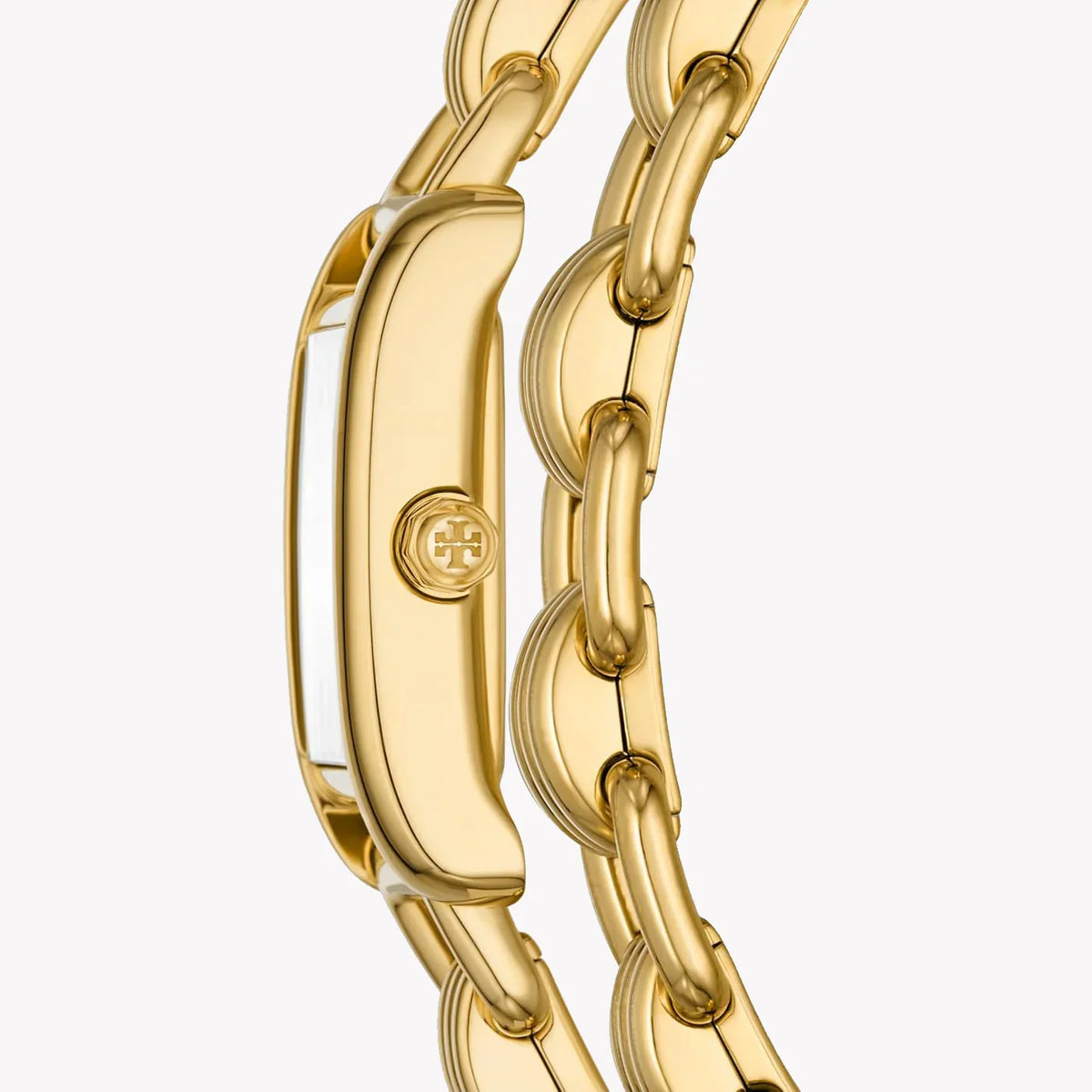 Angled view of Tory Burch Mini Eleanor gold case and double wrap bracelet detail
