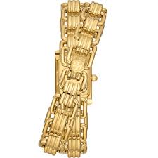 Side view of Tory Burch Mini Eleanor watch with gold double wrap bracelet