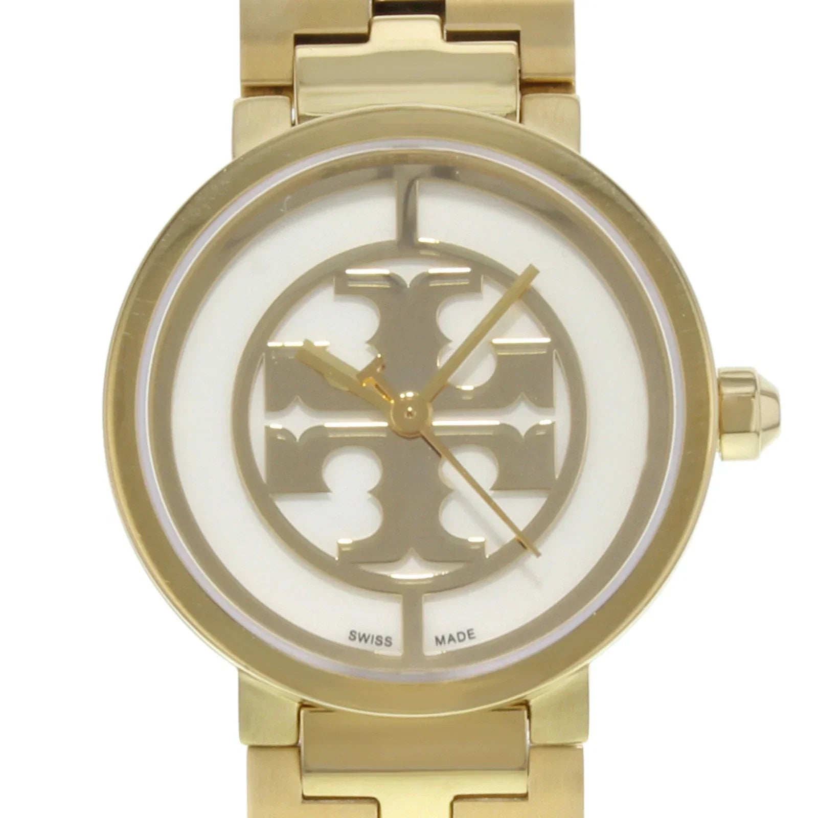 Close-up of Tory Burch Reva dial showing small logo design and Swiss made marking