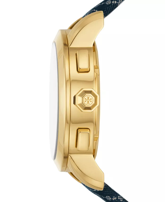 Gold-tone case side profile showing chronograph pushers and Tory Burch logo on crown with navy fabric strap