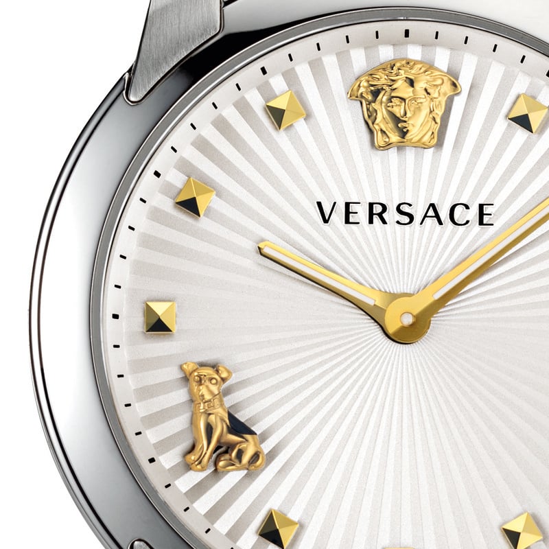 Close-up dial detail of Versace Audrey watch with gold Medusa head and pyramid studs