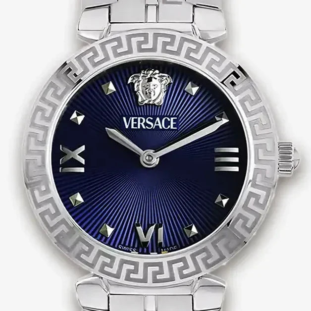 Versace Daphnis dial detail with blue sunburst, Roman numerals, diamond indices, and Medusa logo