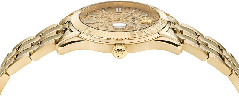 Close-up detail of Versace Greca Time dial with gold texture, applied indices, and date window