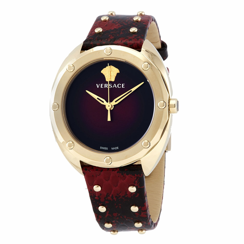 Angled view of Versace Shadov watch showing red dial and gold-tone case with red leather strap