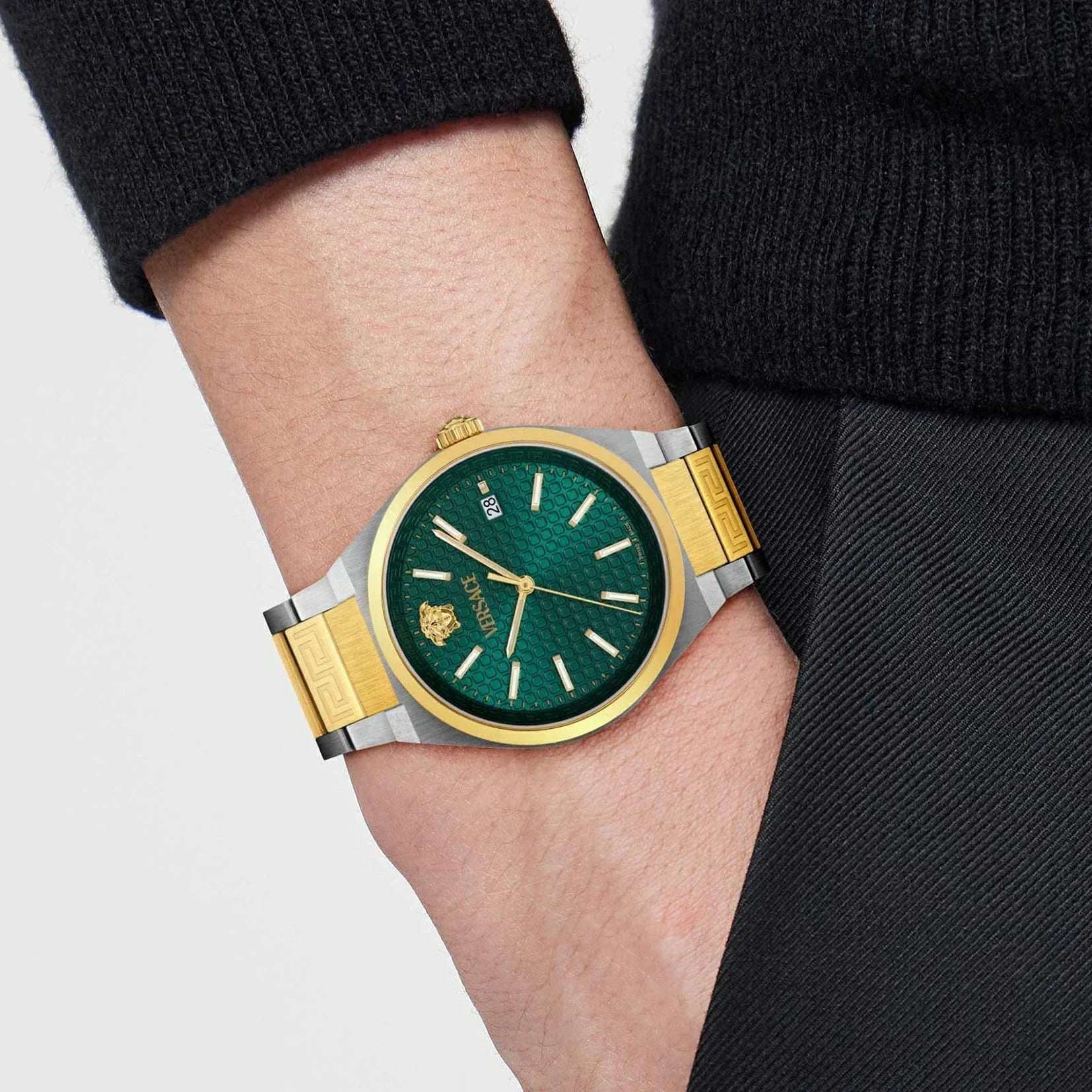 Versace V-Auria watch worn on wrist with green dial visible