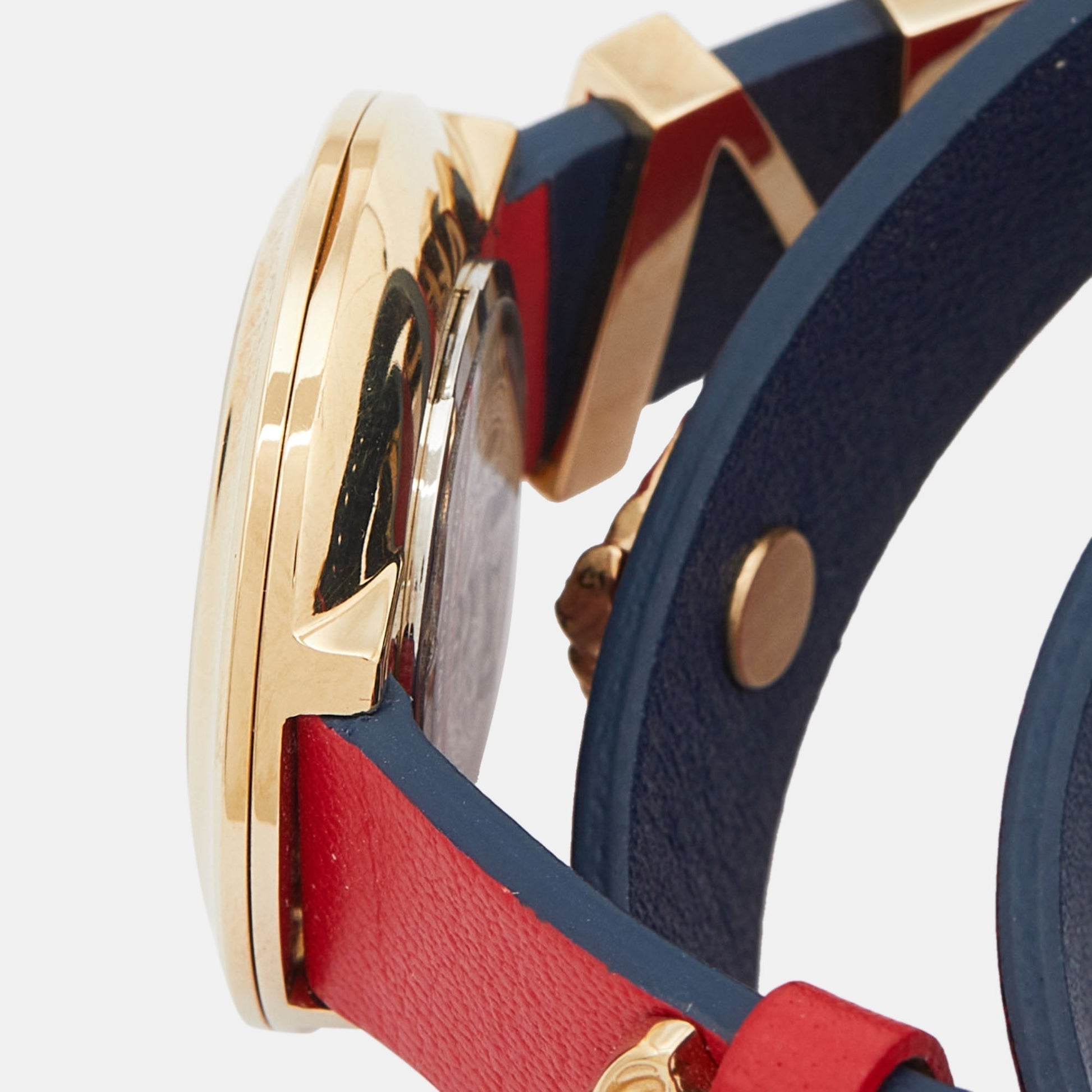 Caseback of Versace V-Flare showing stainless steel with dual red and navy leather straps