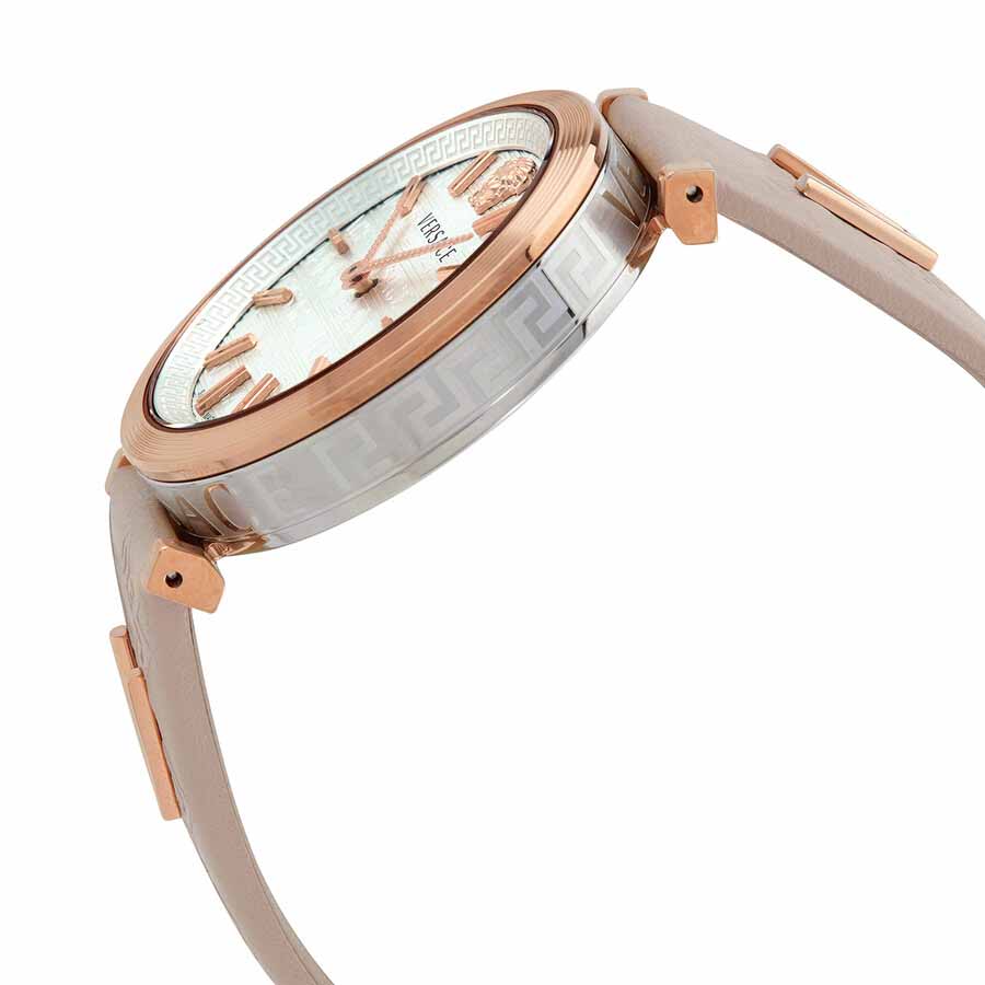 Versace V-Twist women's watch worn on wrist, displaying white dial with rose gold accents and white leather band