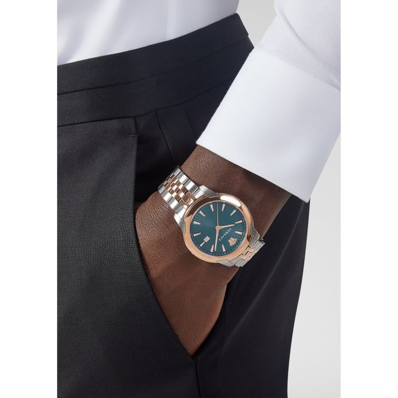 Versace V-Urban green dial watch worn on wrist with two-tone metal bracelet