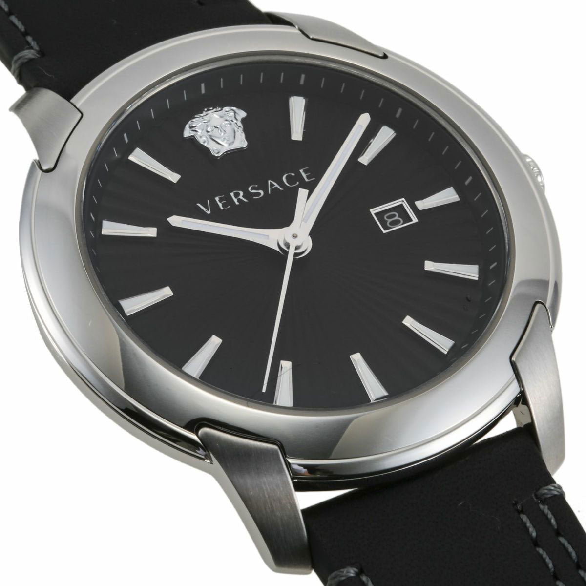 Versace V-Urban dial detail showing black face, white indices, Medusa logo, and date window