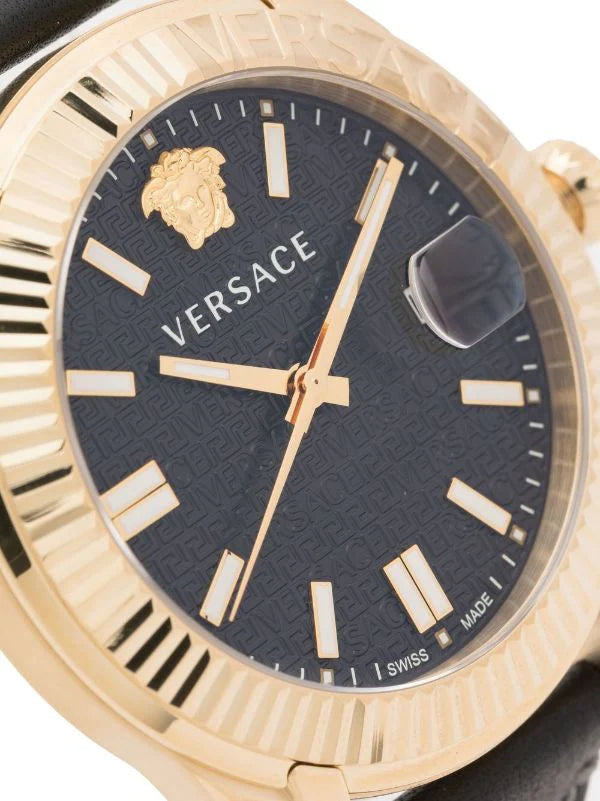 Close-up of Versace Aion Chrono black dial with Medusa head logo, hour markers, and gold hands