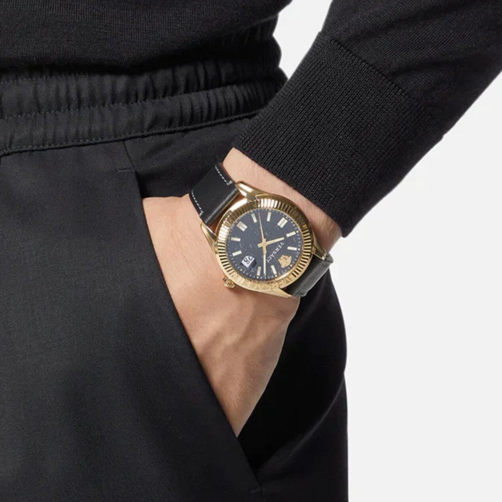 Versace Aion Chrono watch worn on wrist with black dial and gold-tone case