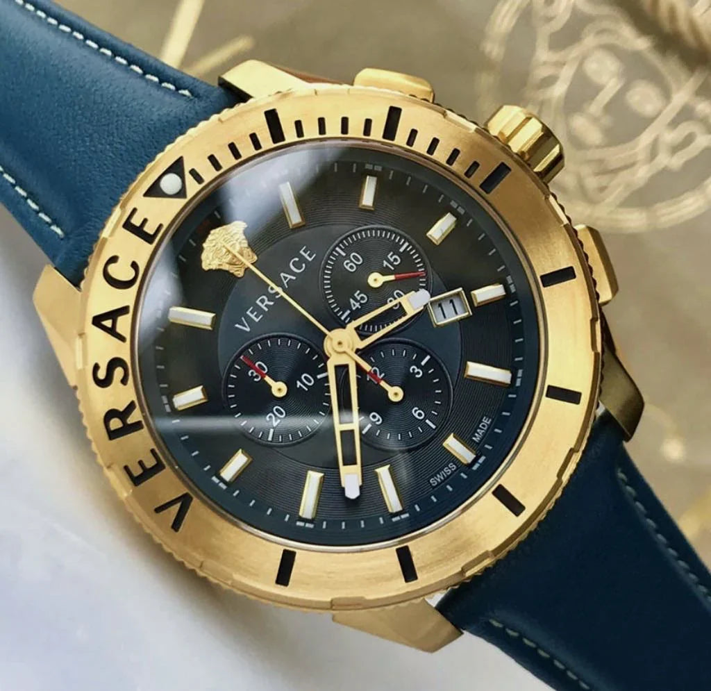 Close-up of Versace watch dial with chronograph subdials and Medusa logo on blue background