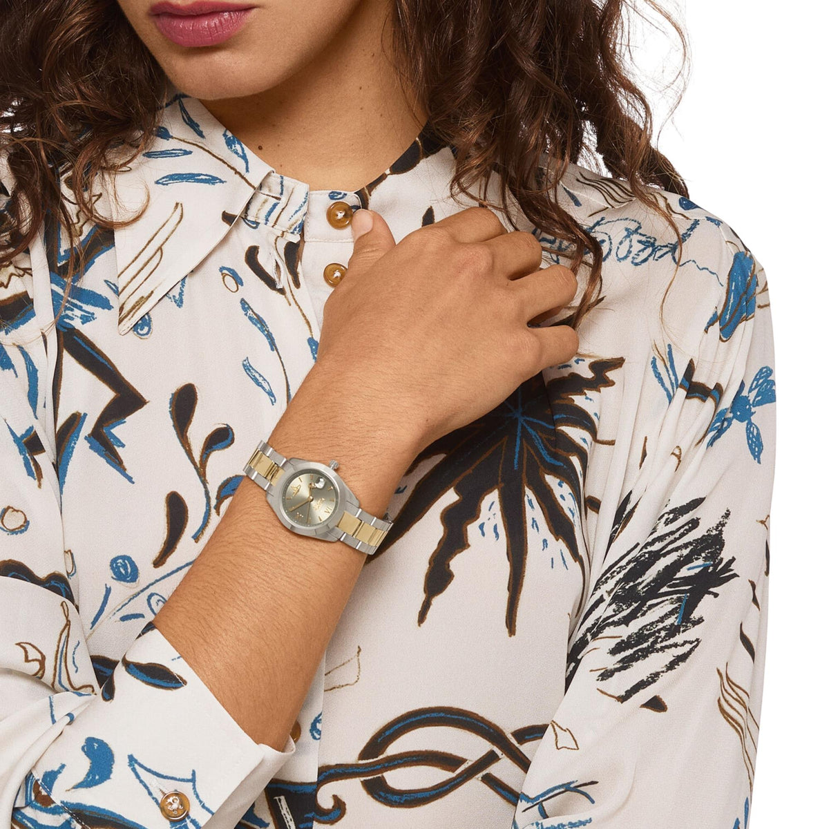 Vivienne Westwood Fenchurch watch on wrist, close-up view of two-tone bracelet and dial