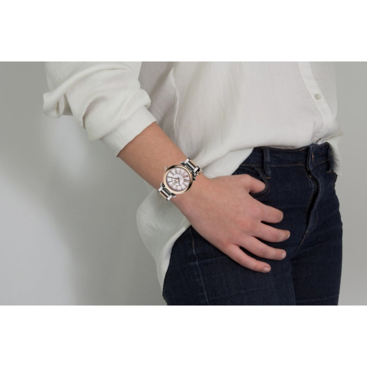Vivienne Westwood Mother Orb watch worn on wrist, two-tone design with rose gold and silver tones