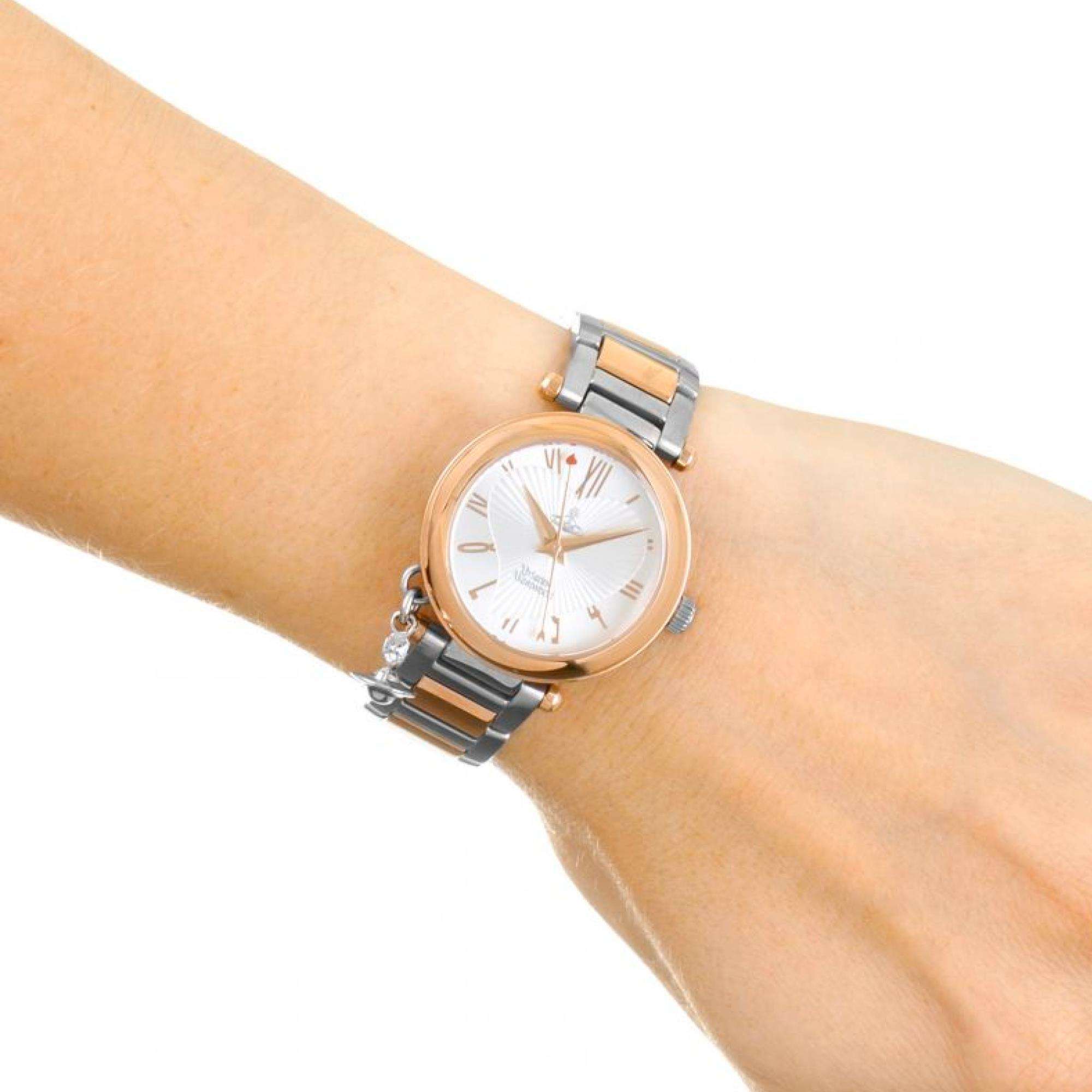 Vivienne Westwood Orb watch on wrist showing silver dial and two-tone bracelet