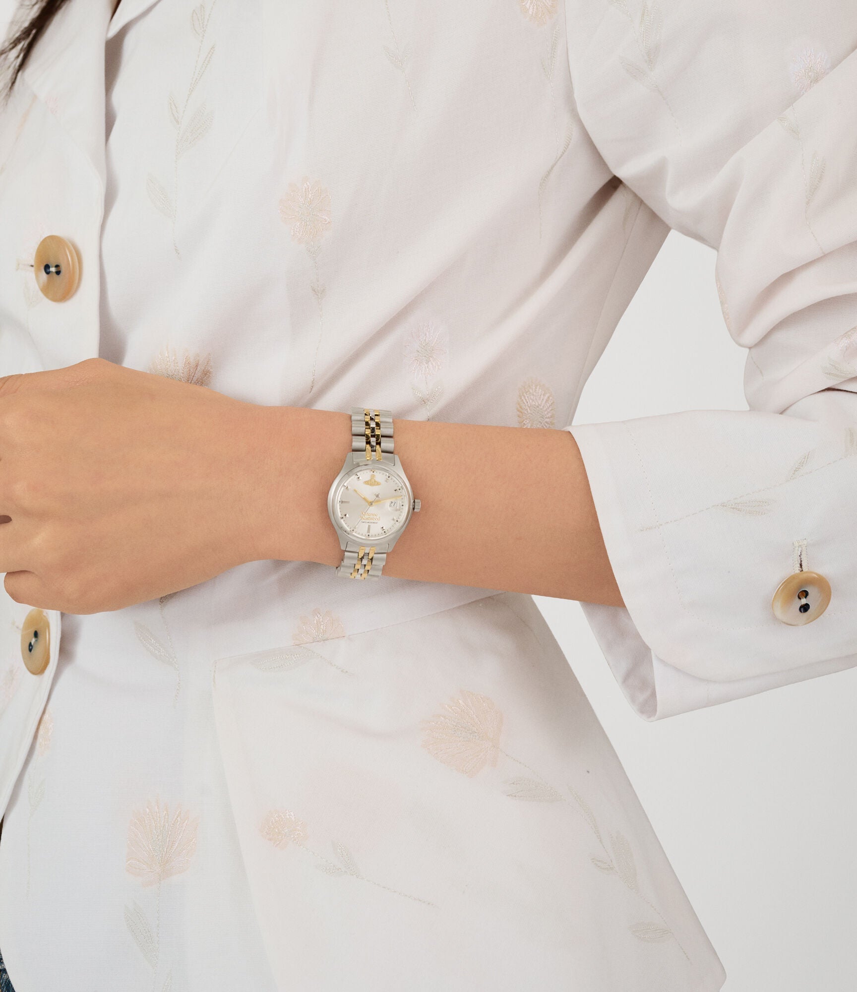 Vivienne Westwood Little Camberwell watch worn on wrist with silver dial and mixed metal bracelet