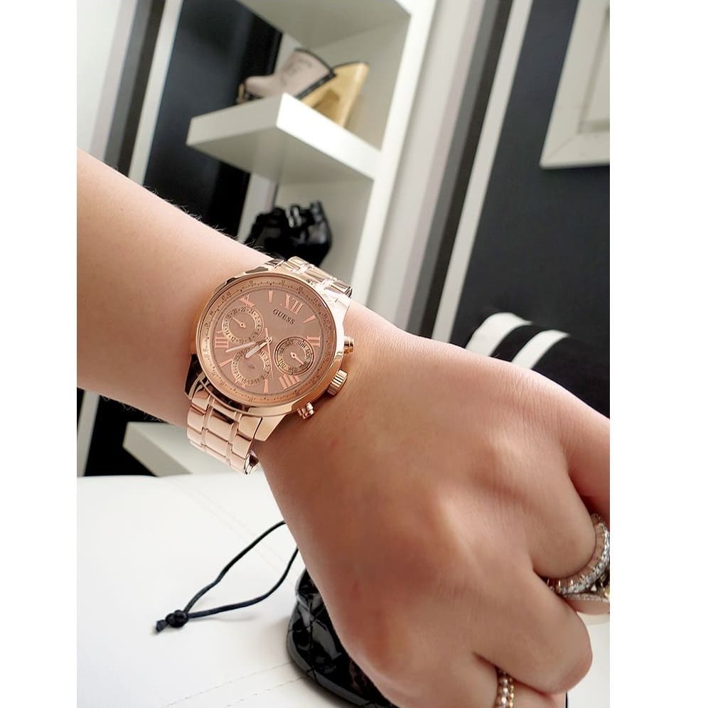 Guess Sunrise rose gold chronograph watch worn on wrist showing dial and bracelet fit